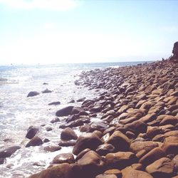 Scenic view of sea against cloudy sky