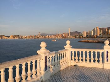 View of sea against buildings in city