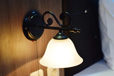 Close-up of electric lamp on table