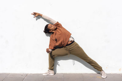 High angle view of man climbing on wall