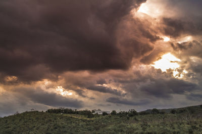 Scenic view of dramatic sky during sunset