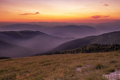 Scenic view of mountains against sky during sunset