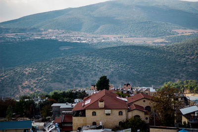 High angle view of townscape and mountains