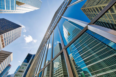 Low angle view of modern buildings against sky