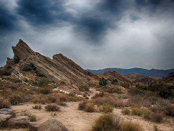 Scenic view of mountains against cloudy sky