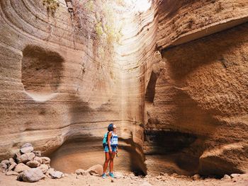 Full length of man standing on rock