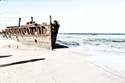 Scenic view of beach against clear sky