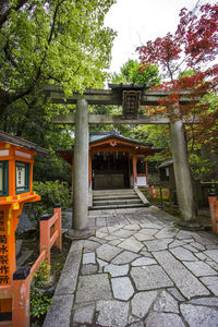 Entrance of temple against building