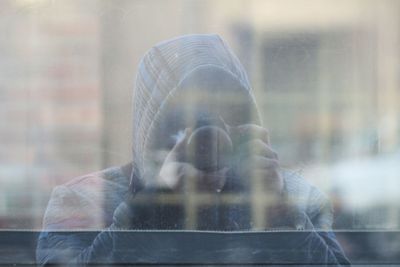 Close-up of man in window