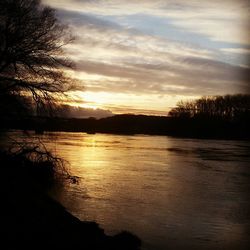 Scenic view of lake at sunset