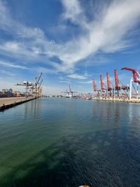 Pier at harbor against sky