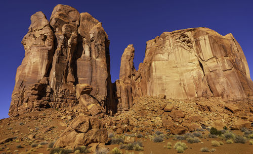 Low angle view of rock formation against sky