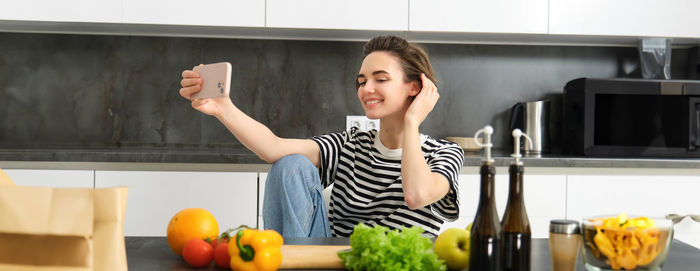 Portrait of young woman exercising in gym