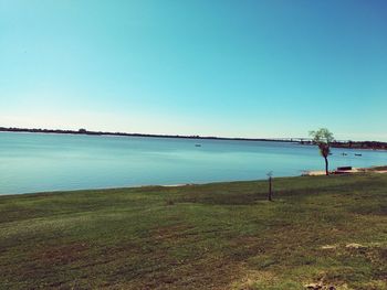 Scenic view of sea against clear blue sky