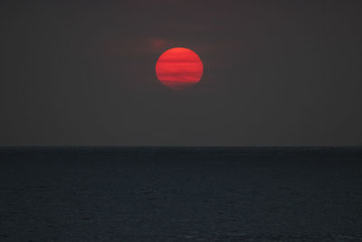 Scenic view of sea against clear sky during sunset