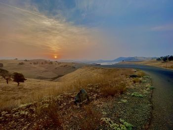 Dawn slowly breaks, painting the sky above and the lands below in all the vibrant colors of nature.