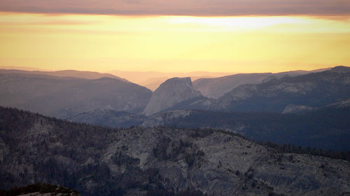 Scenic view of mountains against sky during sunset