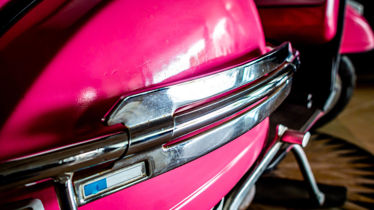 CLOSE-UP OF PINK CAR