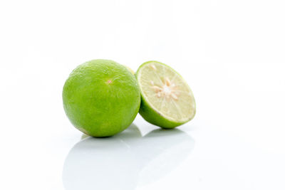 Close-up of fruits against white background