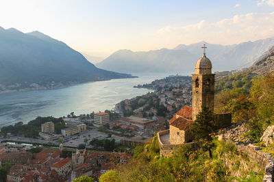 Christian temple on the background of the sea and mountains. bako-kotor bay at sunset