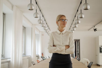 Confident businesswoman in conference room