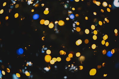 Defocused image of illuminated lights at night