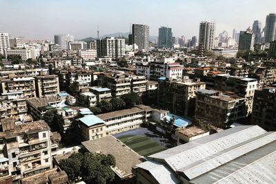 High angle view of buildings in city against sky