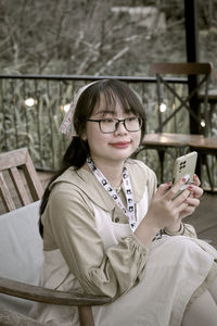 Young woman using mobile phone