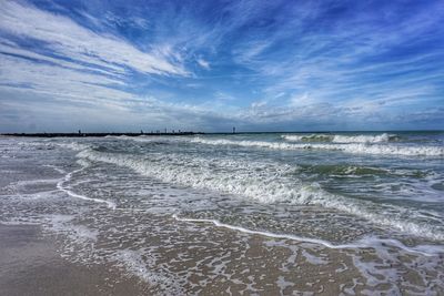 Scenic view of sea against blue sky