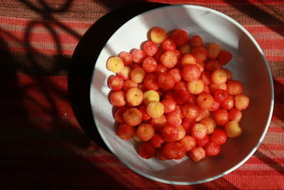 High angle view of strawberries in bowl on table