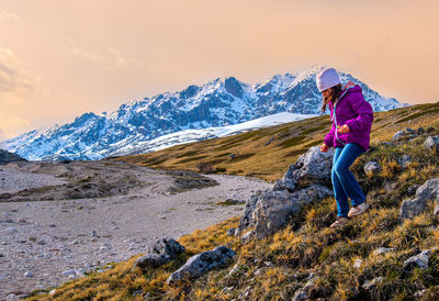 Rear view of man walking on mountain