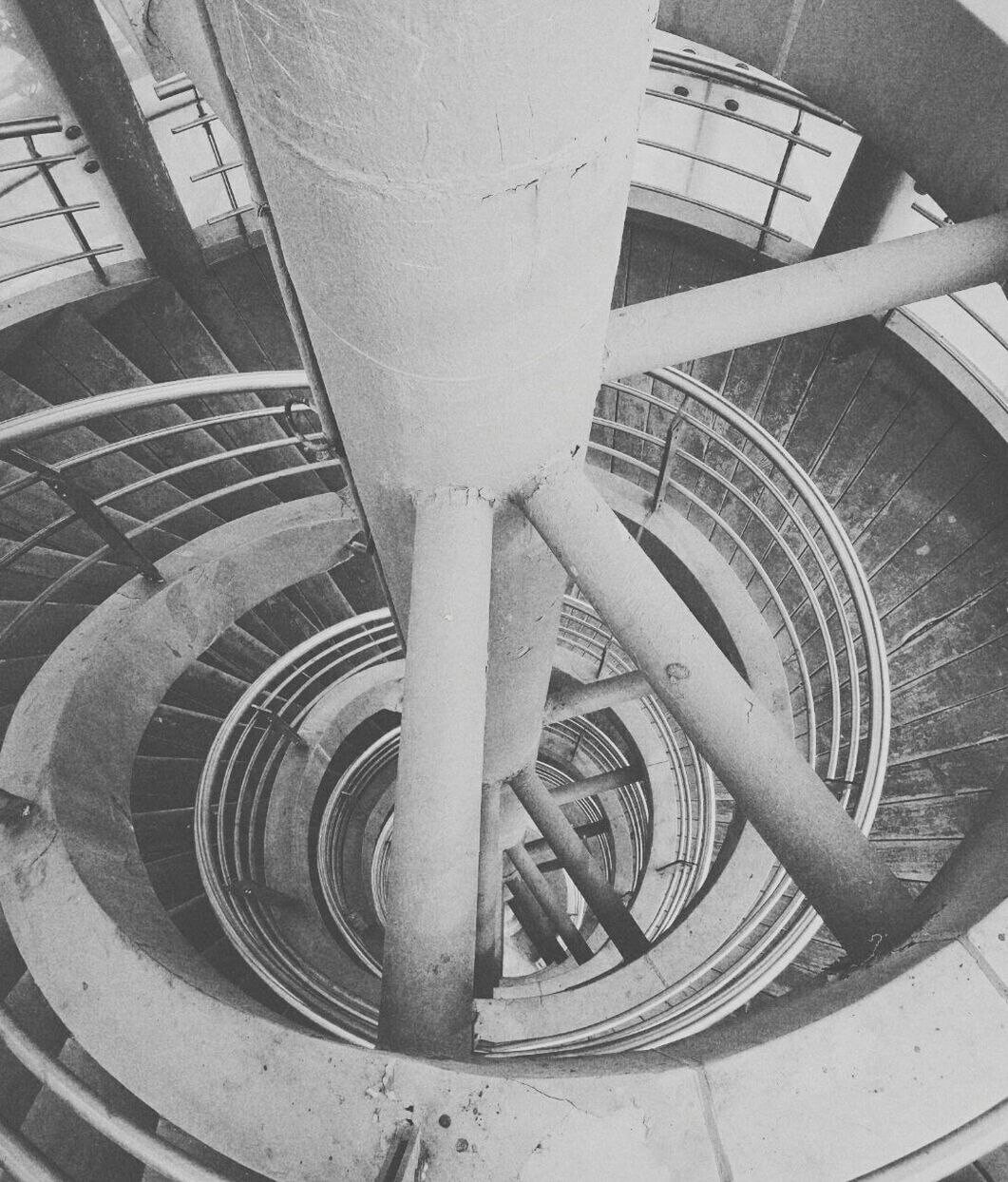 steps and staircases, built structure, staircase, steps, railing, architecture, high angle view, metal, spiral, building exterior, spiral staircase, transportation, building, metallic, no people, low angle view, day, pattern, modern, outdoors