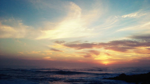 Scenic view of sea at sunset