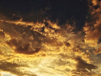 Scenic view of dramatic sky at sunset