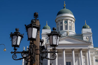 Low angle view of building against clear blue sky