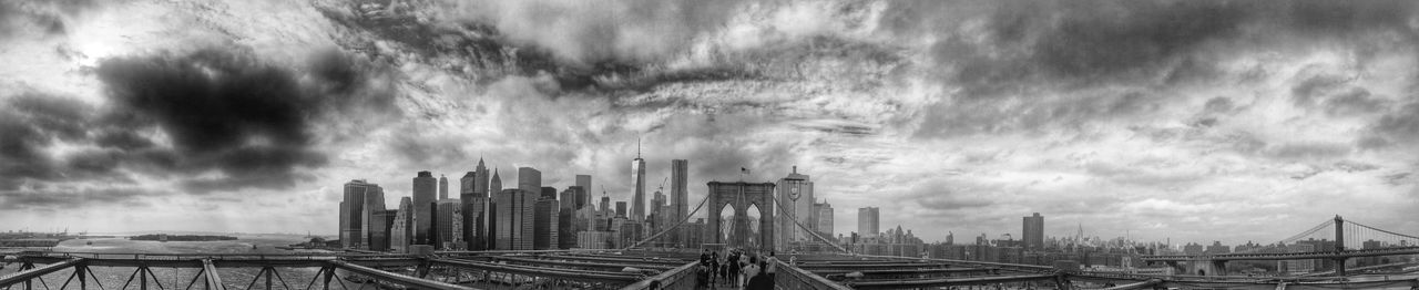 City skyline against cloudy sky