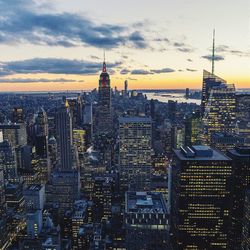 Cityscape against cloudy sky