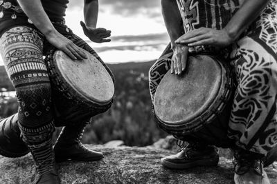 Low section of people playing drum