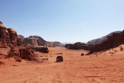 Scenic view of desert against clear sky