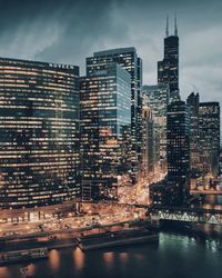Buildings in city at dusk