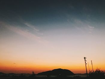 Scenic view of silhouette mountain against sky during sunset