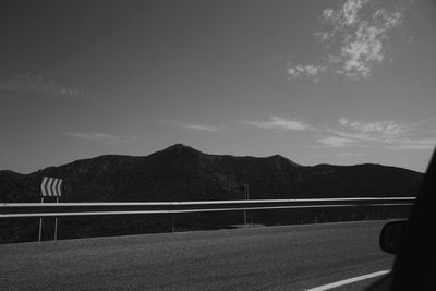 Scenic view of mountain road against sky