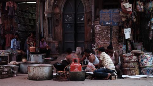 People sitting outside building