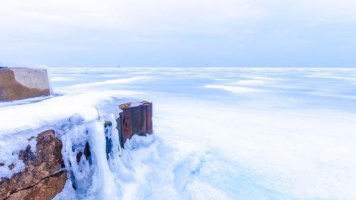 Scenic view of sea against sky during winter