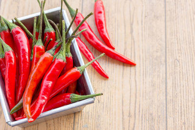 Close-up of red chili peppers on table