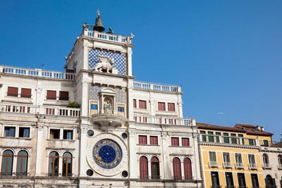 Low angle view of building against blue sky