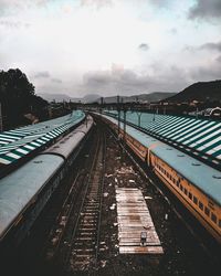 Train at railroad station against sky