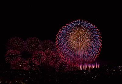 Firework display at night