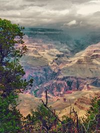 Scenic view of landscape against cloudy sky