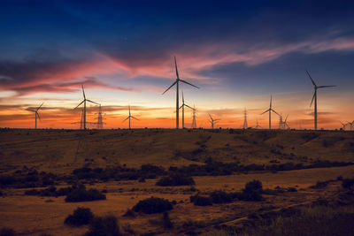 Scenic view of field against sky during sunset